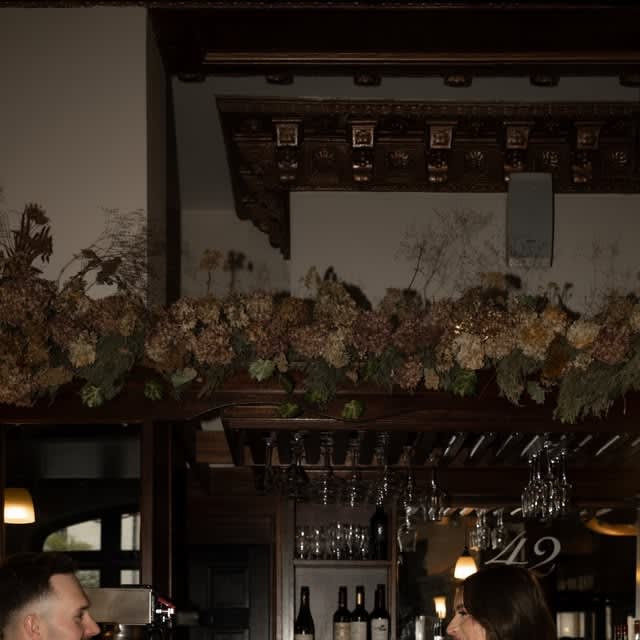 A newly married couple celebrating at the bar inside Jack's Oyster House